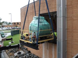 MRI scanner being lifted into a building